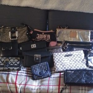 Bundle of name brand wallets and makeup bags.